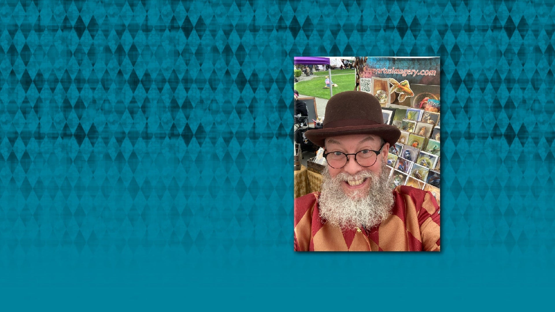 Man with a beard and glasses on a magazine cover with a blue patterned background