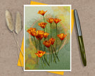 A stylized floral greeting card showing a cluster of orange poppy-like flowers with green stems on a textured pale green background with soft yellow bokeh circles and a faint circular line motif. Posed on a kraft paper background with a yellow envelope.