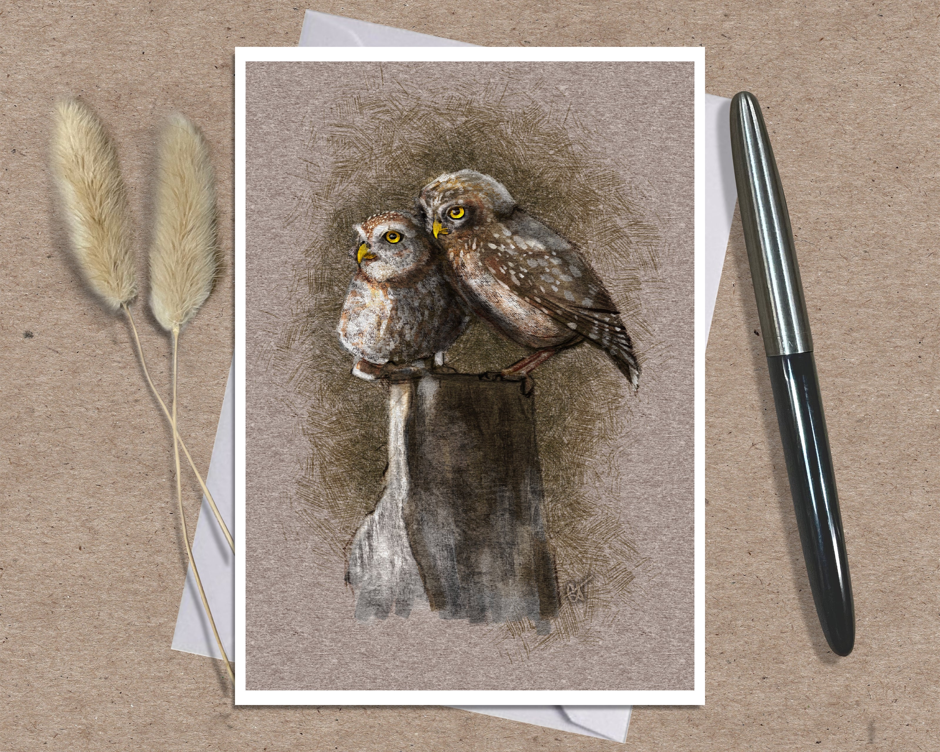 Product photo of a bird greeting card in brown featuring two burrowing pygmy owls on a stump.