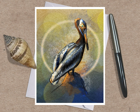 Illustrated greeting card featuring a California Brown Pelican on a stylized textured background of gold and blue, posed on a white envelope with a shell and an ink pen against a brown paper background.