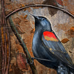 Painting of a bird with red and yellow chest on a textured brown background