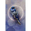 Blue bird figurine on a textured purple background