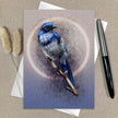 Greeting card with a blue bird illustration on a beige background