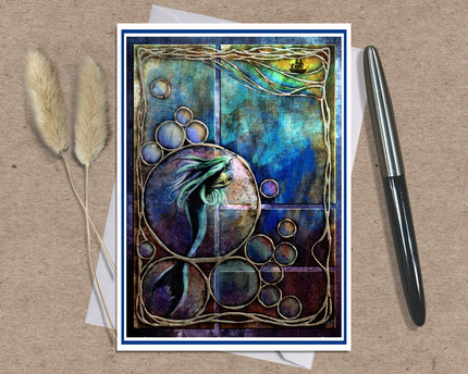 An abstract art print featuring a mermaid and bubbles, styled on a kraft paper background with a black pen and dried pampas grass.