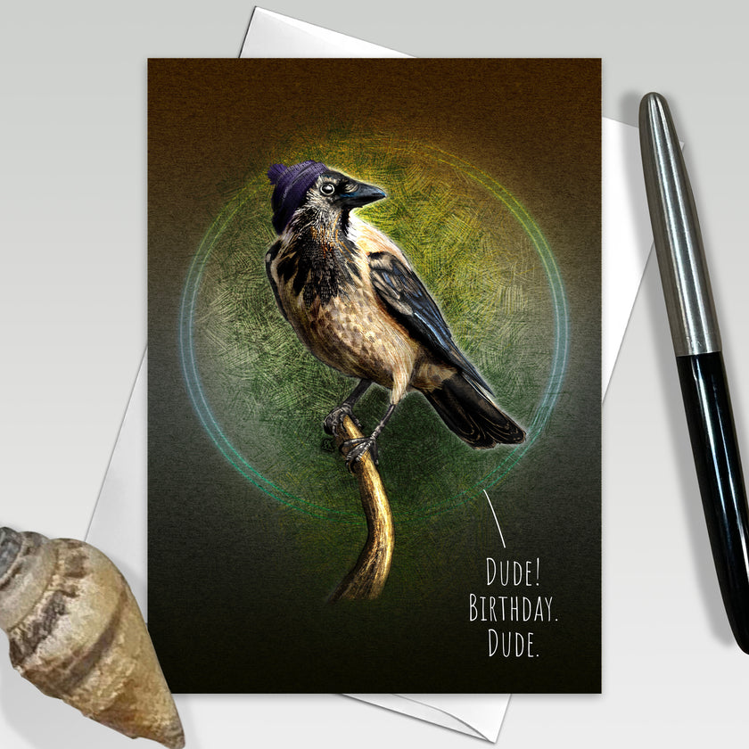 Greeting card with a bird illustration and humorous text, placed on a surface with a pen and shell.