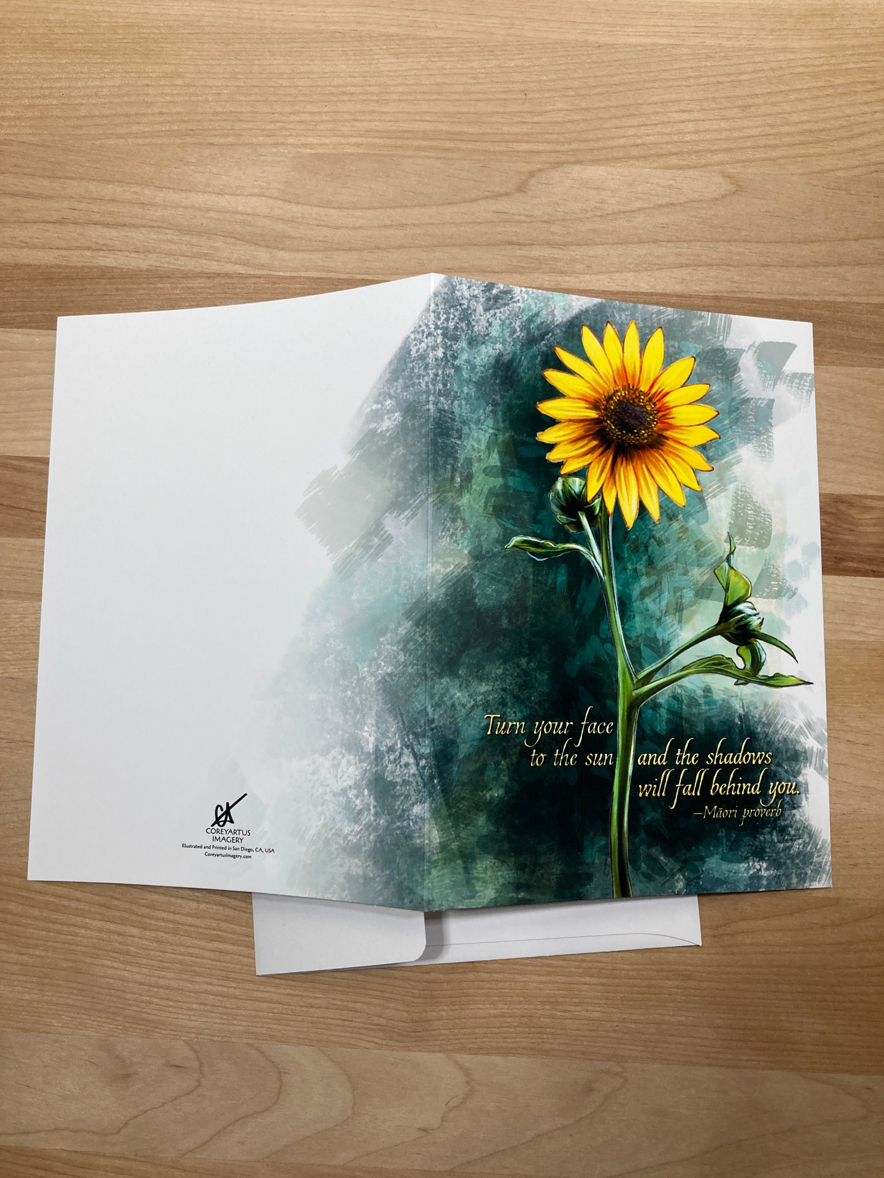 Greeting card with sunflower design on a wooden surface