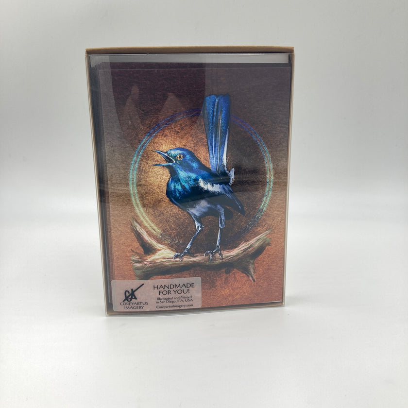 Case of cards with a blue bird illustration on a brown background