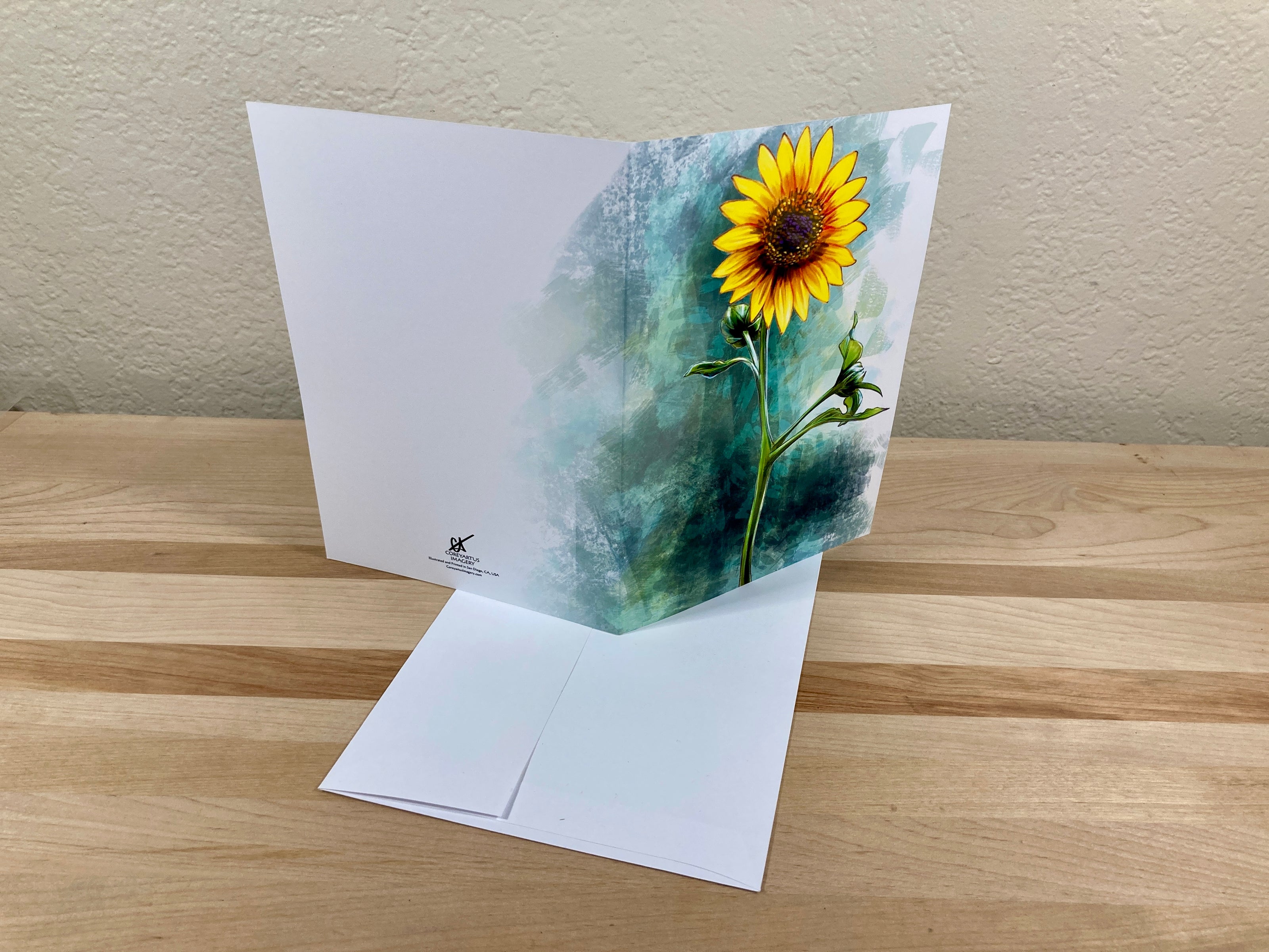 Greeting card with sunflower design on a wooden surface