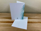 Greeting card with a scenic design on a wooden surface