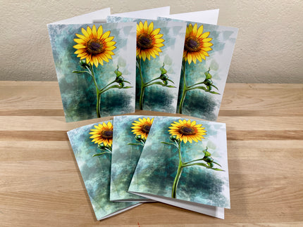 Set of sunflower-themed greeting cards on a wooden surface