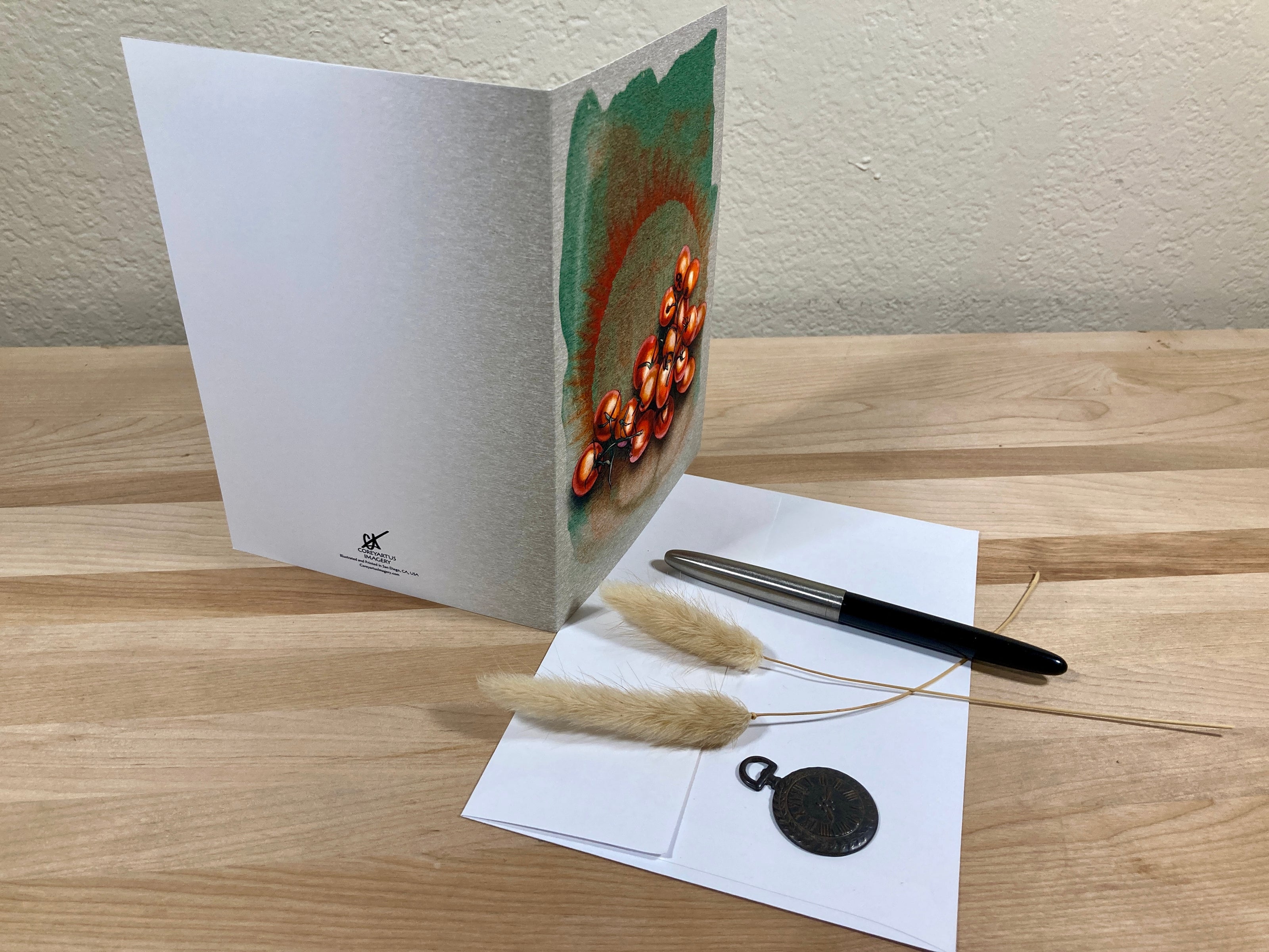 Greeting card with decorative elements on a wooden surface