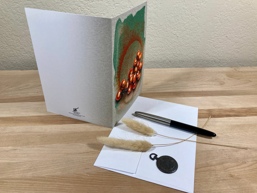 Greeting card with decorative elements on a wooden surface