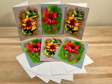Set of floral greeting cards on a wooden surface