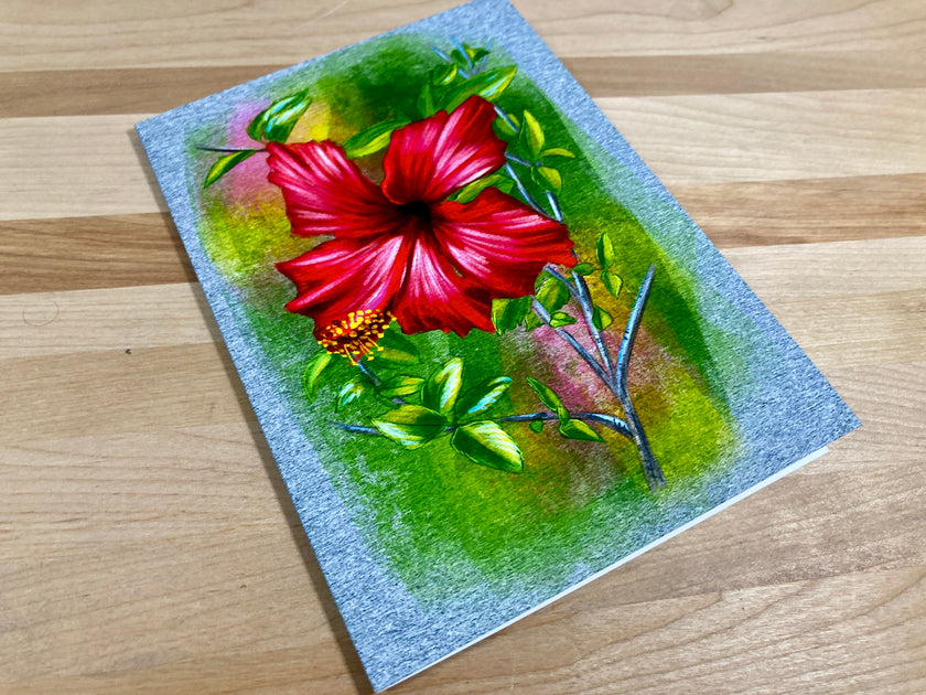 Painting of a red flower on textured paper with a wooden surface background