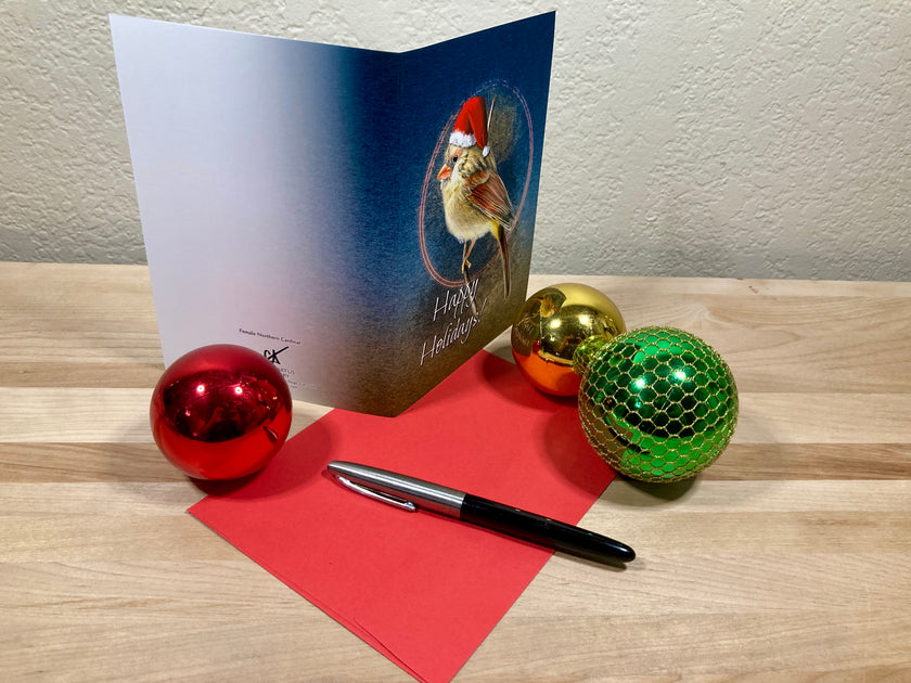 Christmas card with festive decorations on a wooden surface