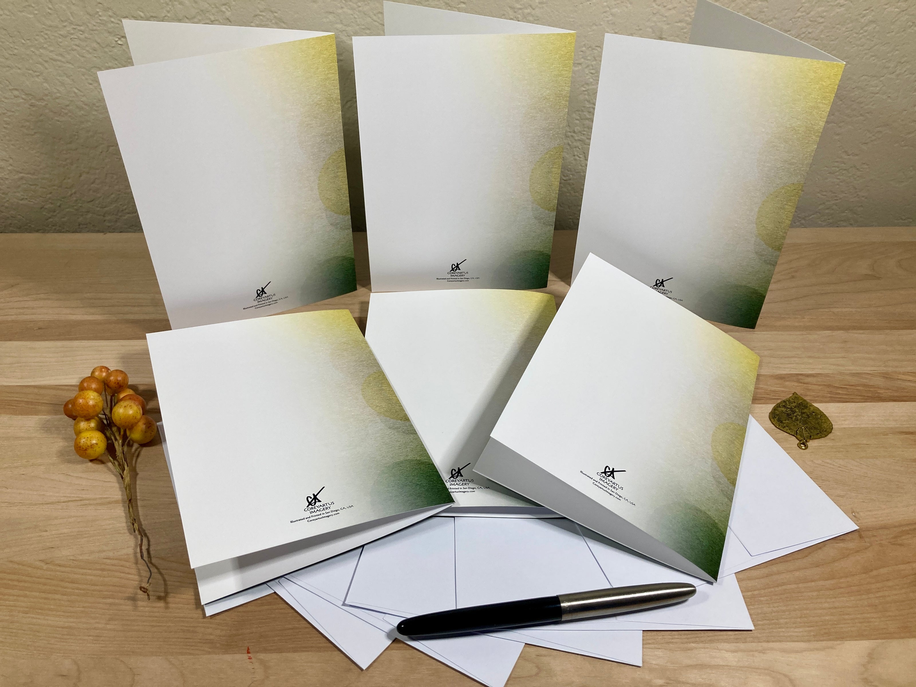 Set of greeting cards with envelopes on a wooden surface
