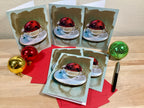 Set of greeting cards with Christmas-themed design on a wooden surface.