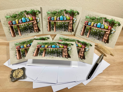 Set of greeting cards with a wooden table and colorful birds design on a wooden surface.