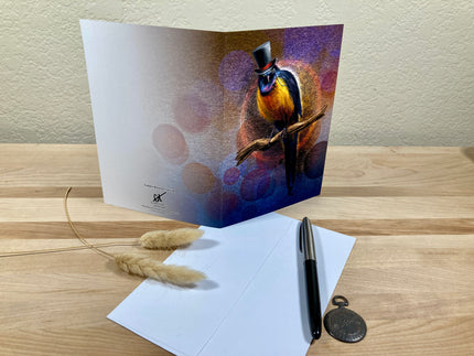 Greeting card with a bird illustration on a wooden surface with an envelope and pen.