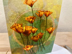 Decorative card with orange flowers on a textured surface