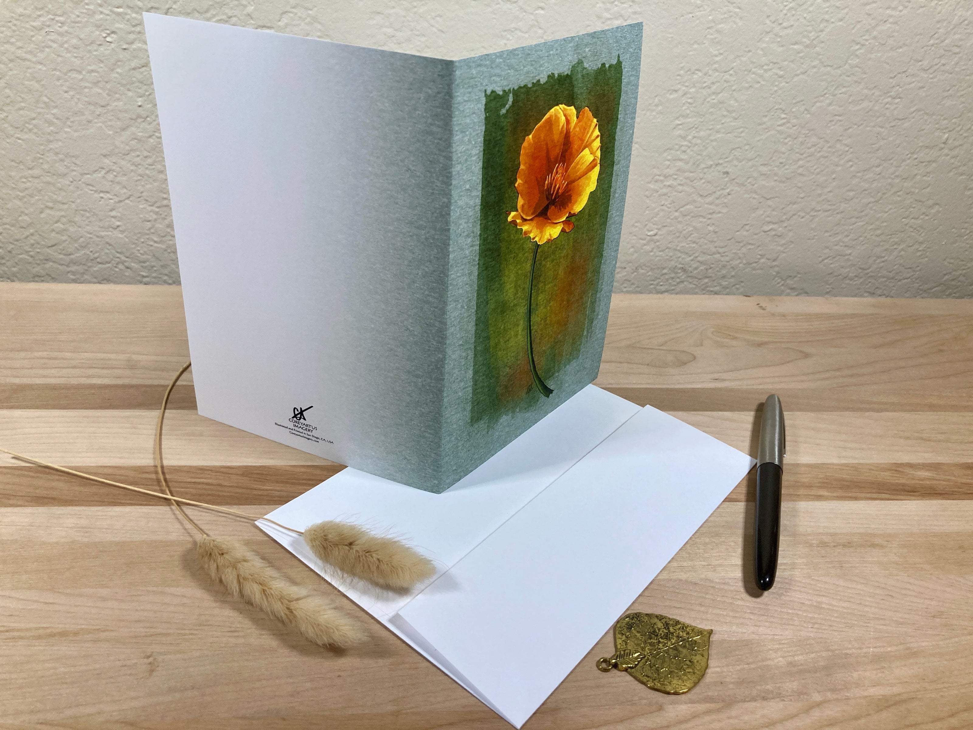 Greeting card with a sunflower design on a wooden surface