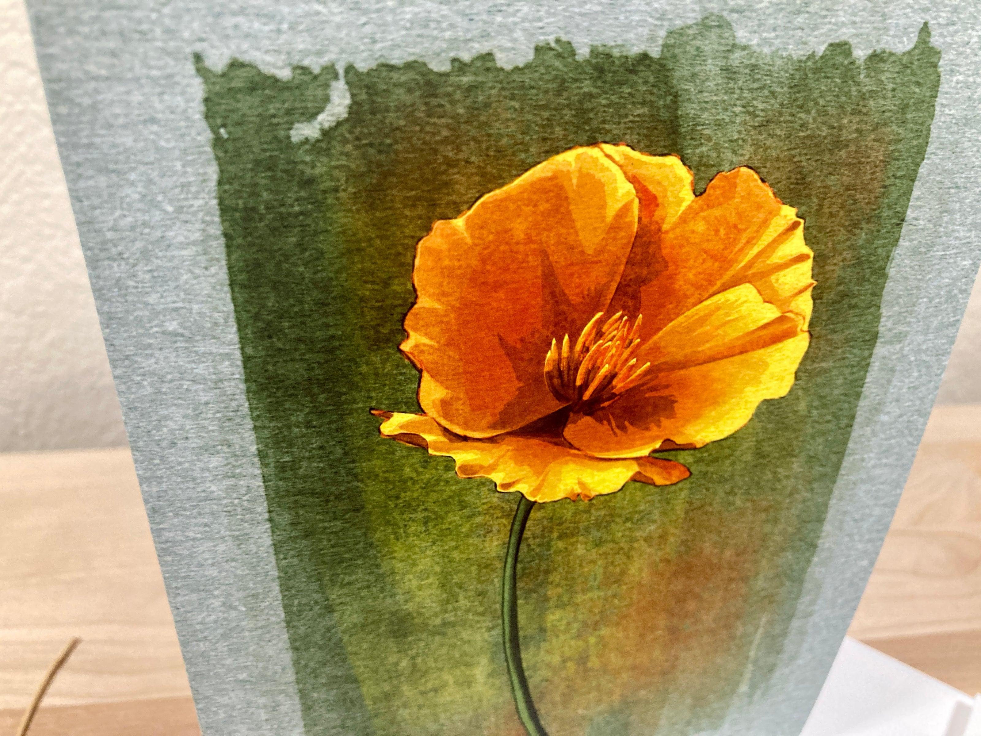 Yellow flower on a textured green and gray background