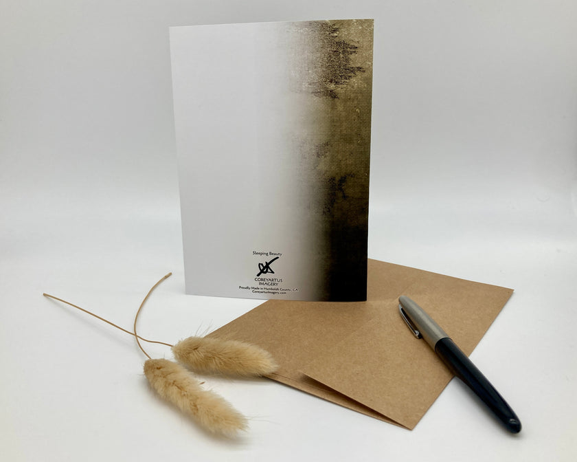 Greeting card with brown envelope and pen on a white background