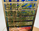 Decorative tile with intricate patterns on a wooden board