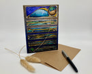 Decorative greeting card with peacock feather design on a white background