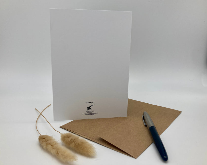 White greeting card with brown envelope and pen on a white background