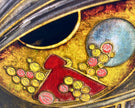 Decorative design with red, yellow, and pink elements on a gold background