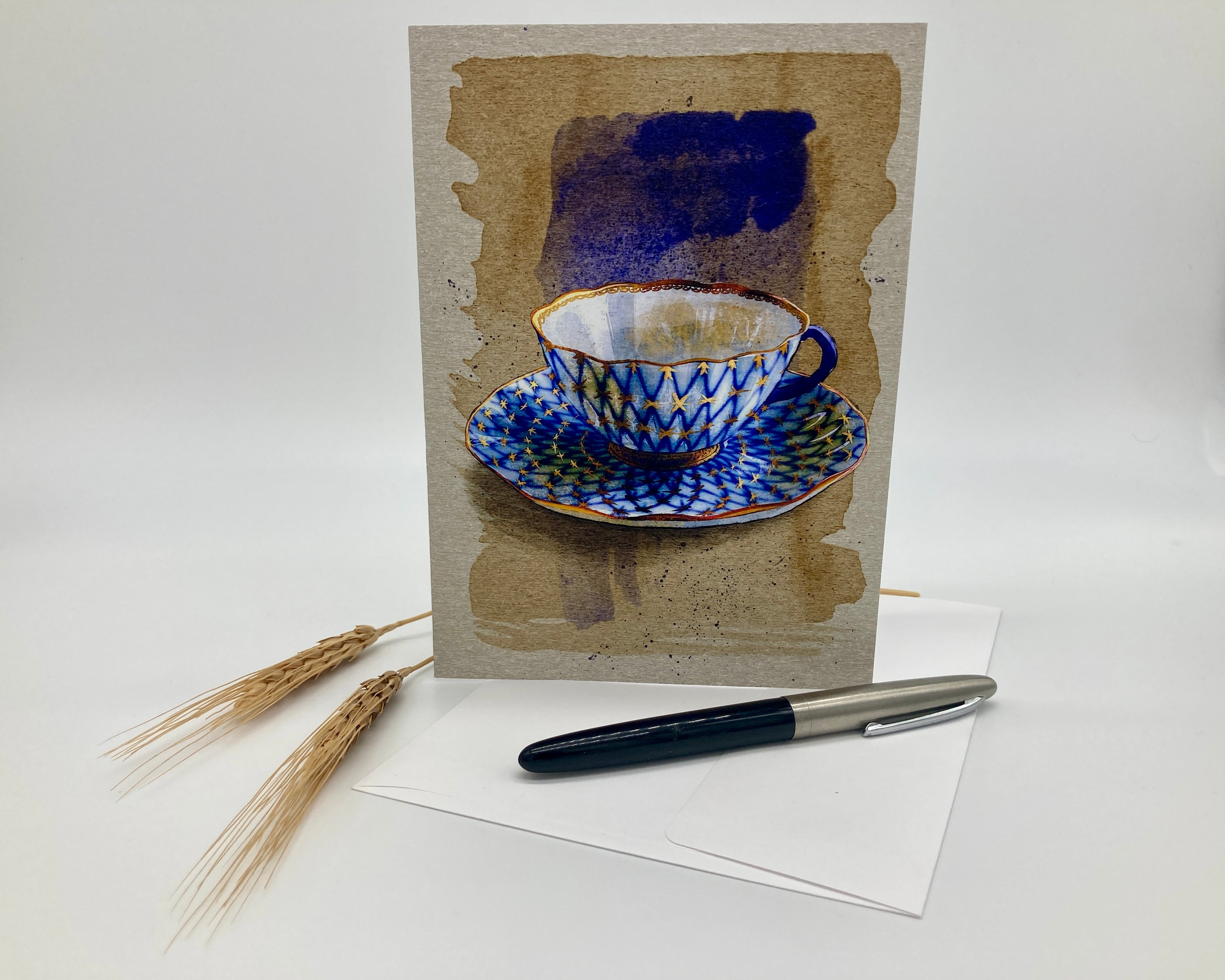 Greeting card with a blue teacup design on a white background
