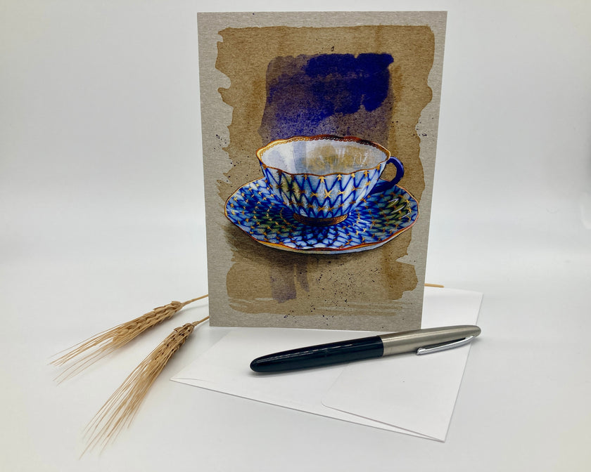 Greeting card with a blue teacup design on a white background