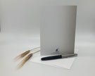 White card with a pen and wheat on a white background