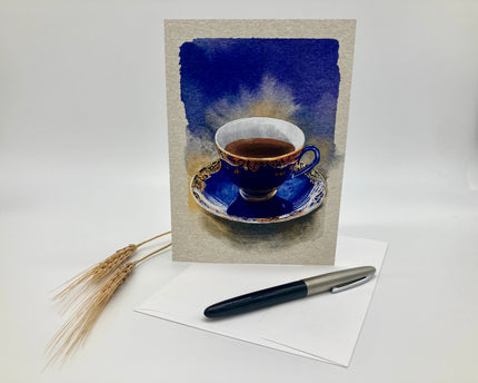 Greeting card with a blue teacup design on a white background