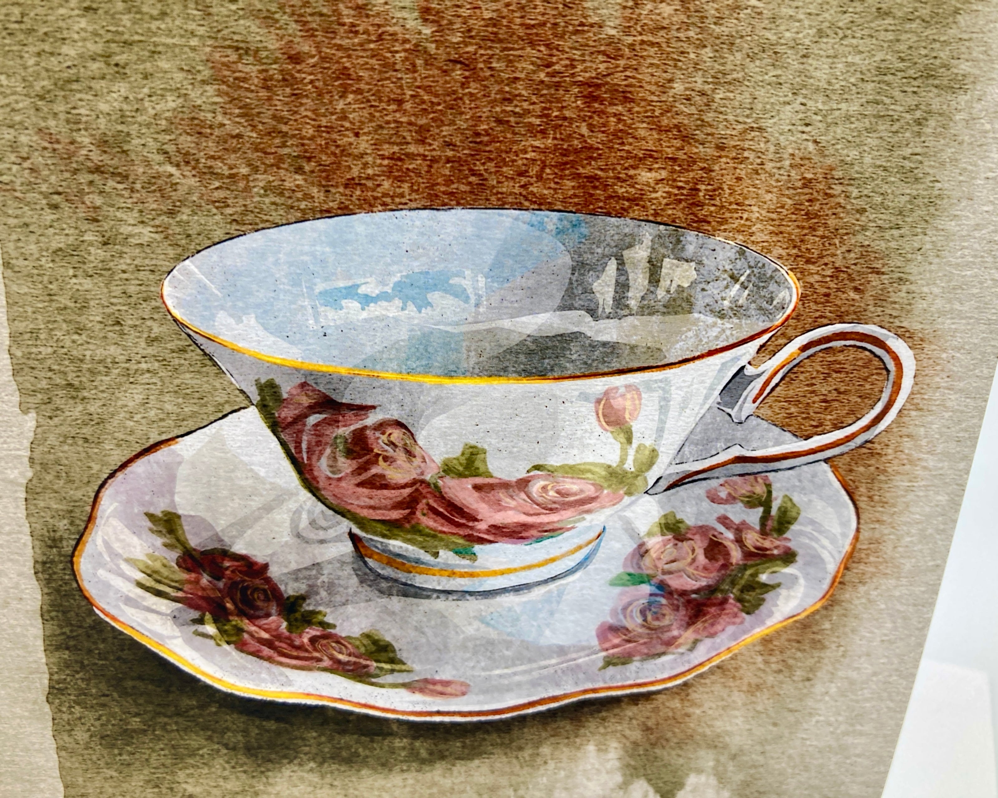 Decorative teacup and saucer with floral design on a textured brown background