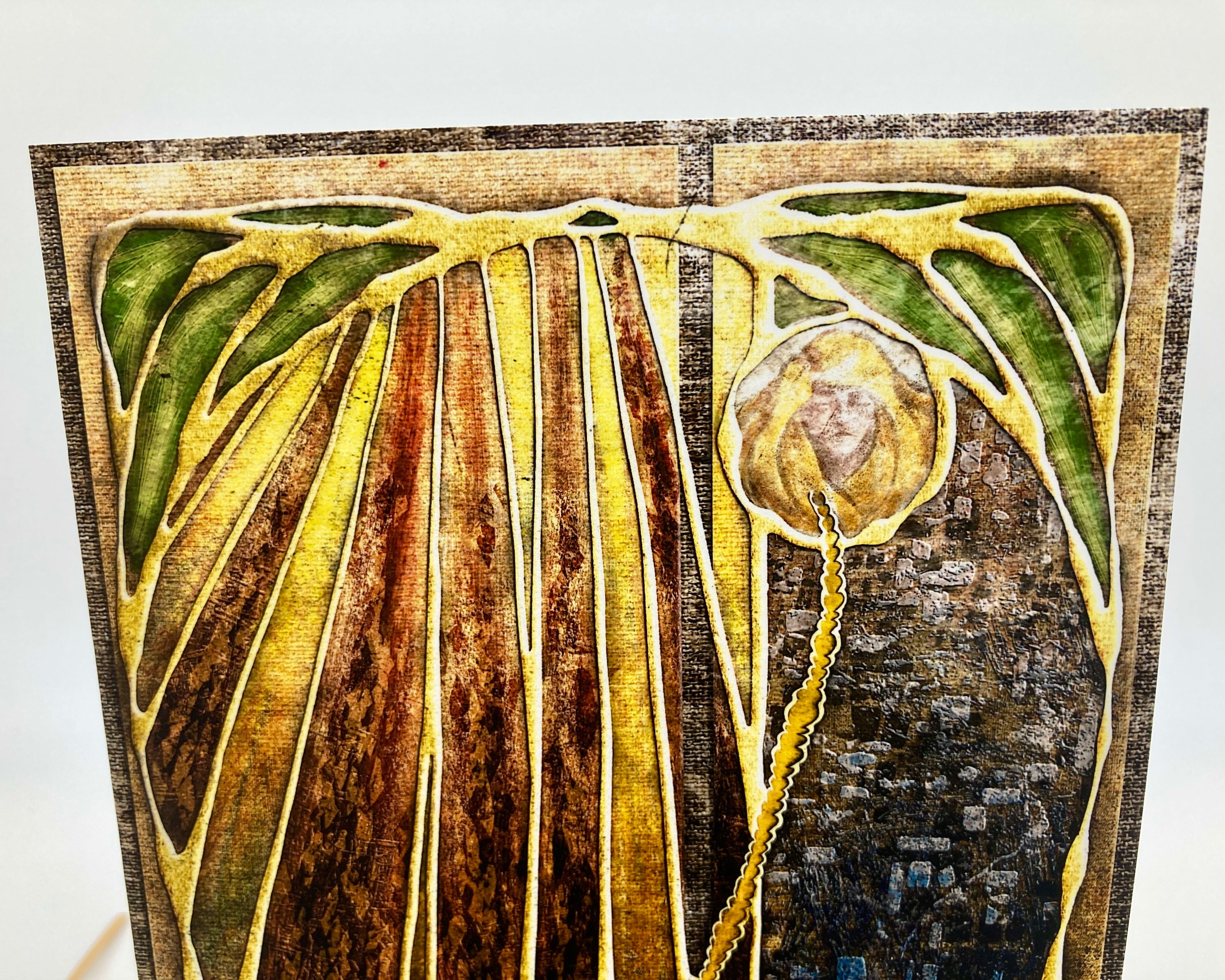 Decorative panel with stylized face and abstract design on a textured background