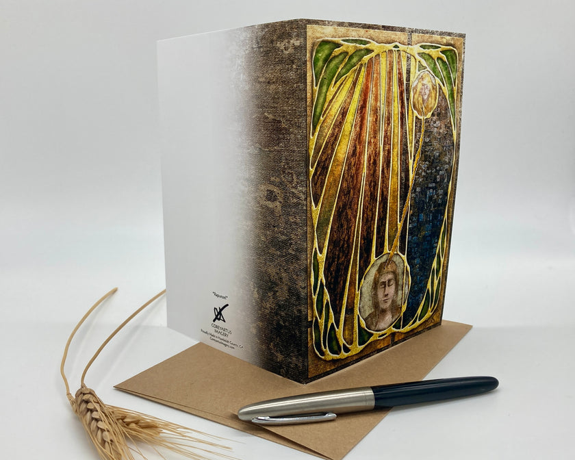 Decorative book with artistic cover design, pen, and paper on a white background