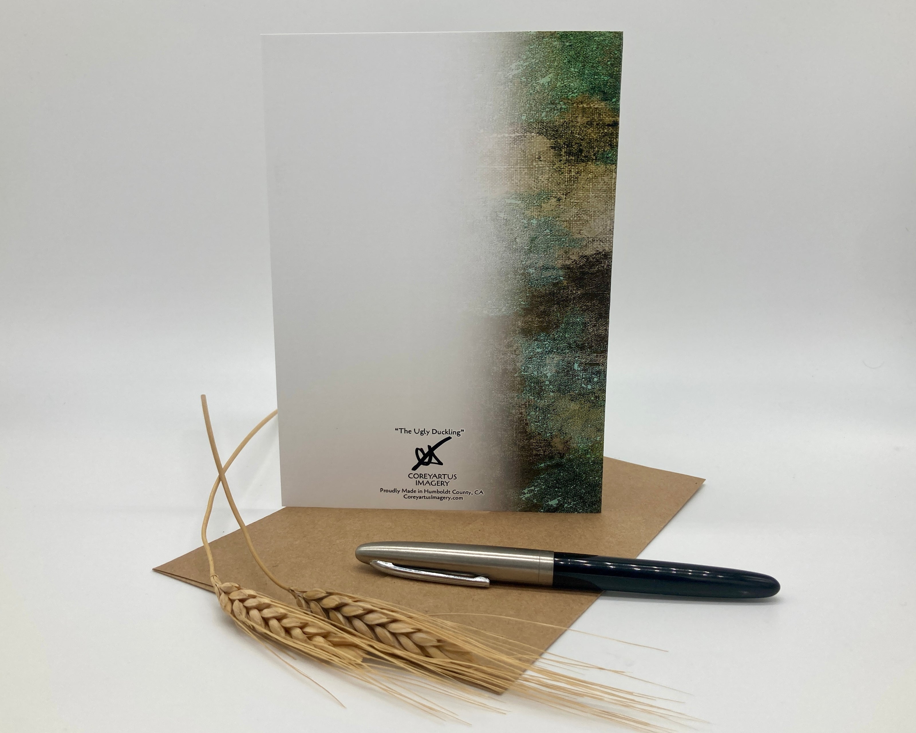 Greeting card with pen and wheat on a white background