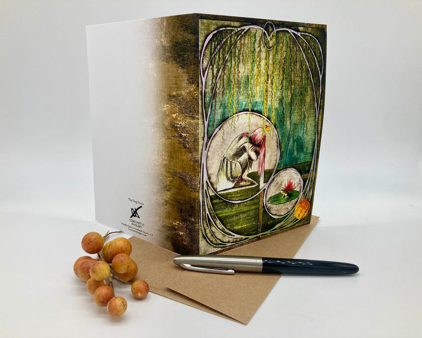 Greeting card with artistic design, pen, and dried fruits on a white background