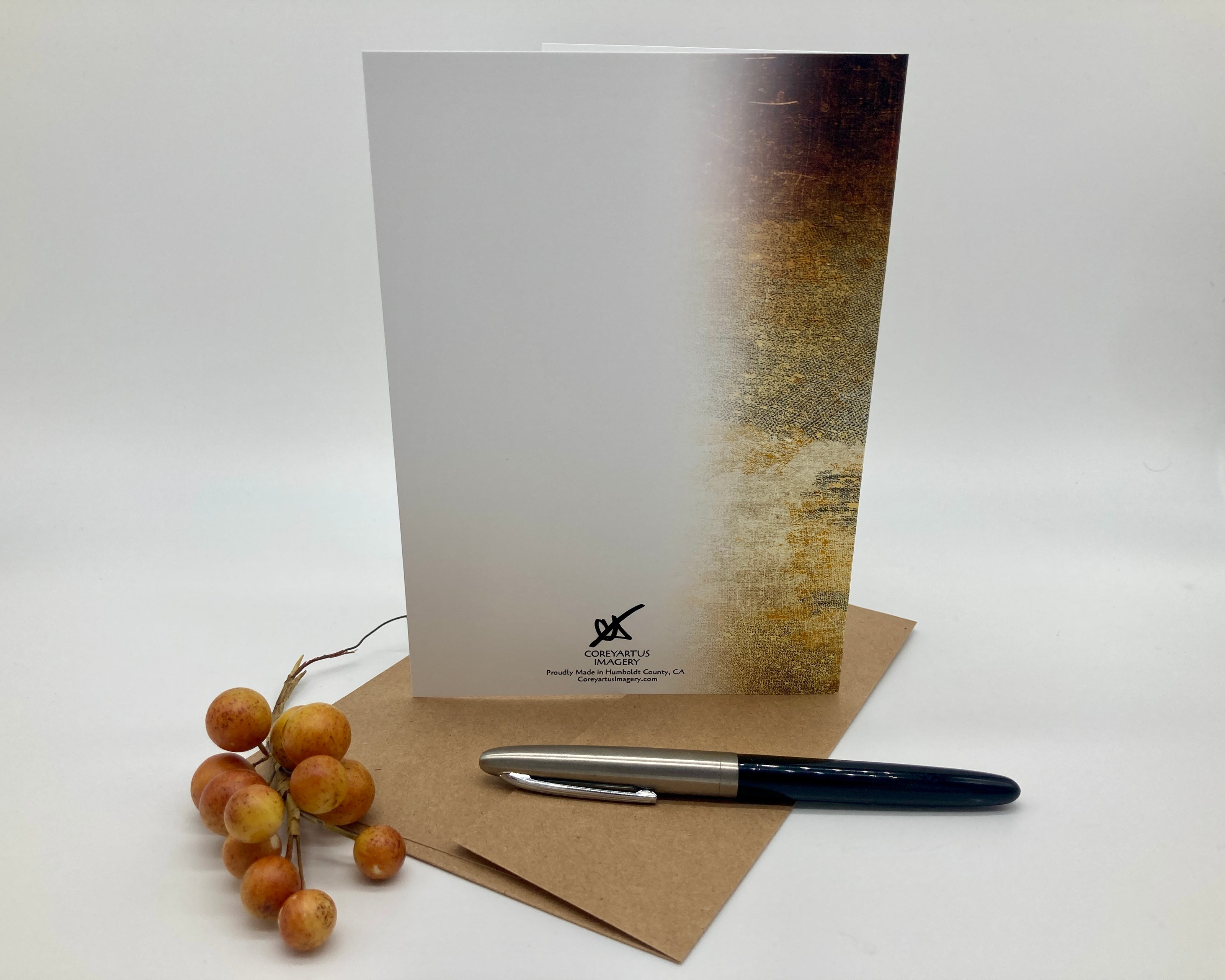 Notebook, pen, and decorative elements on a white background
