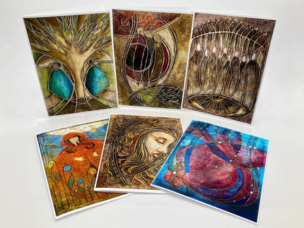 Set of six artistic greeting cards with various designs on a white background