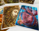 Artistic cards with intricate designs on a white surface