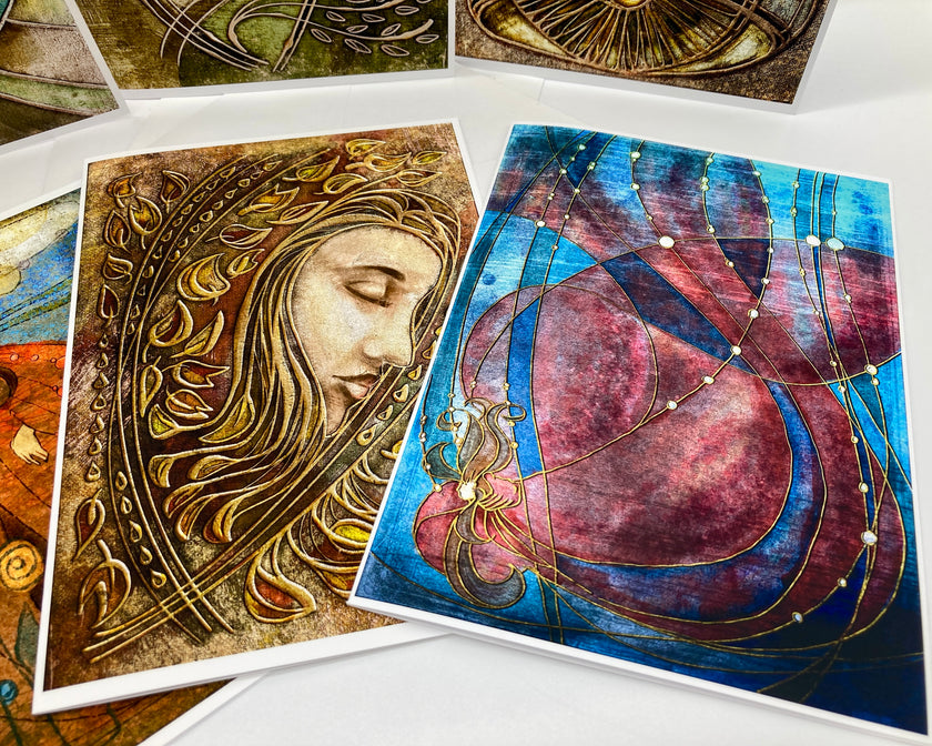 Artistic cards with intricate designs on a white surface