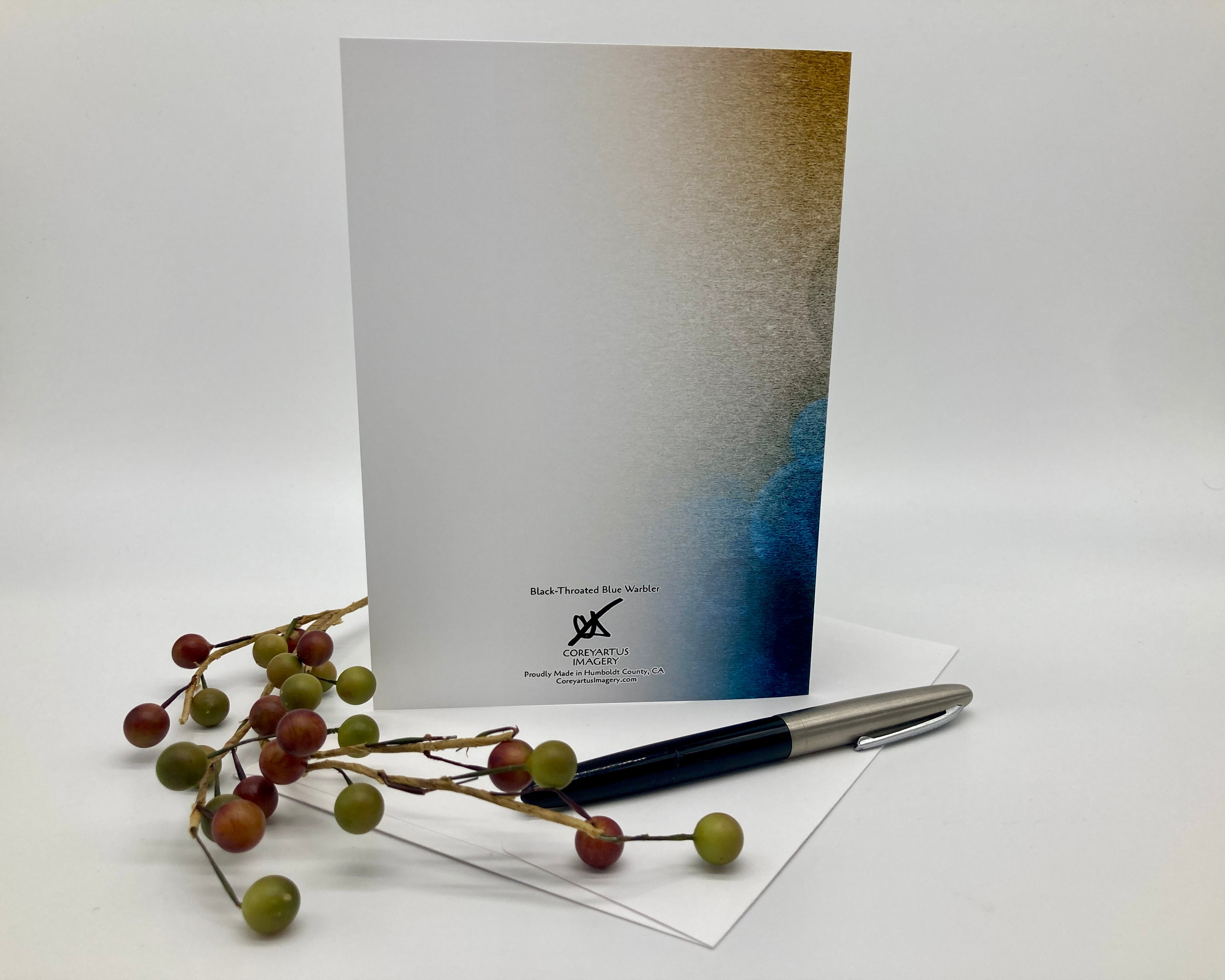 Greeting card with a pen and decorative branches on a white background