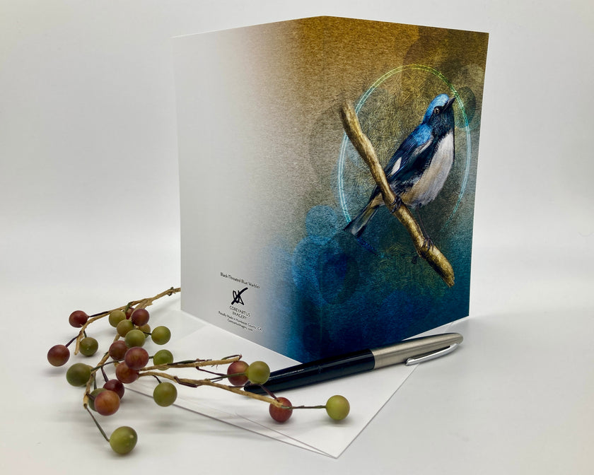 Greeting card with a blue bird design, pen, and branch with berries on a white background