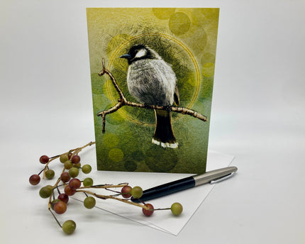 Greeting card with a bird illustration on a branch, surrounded by berries and a pen.