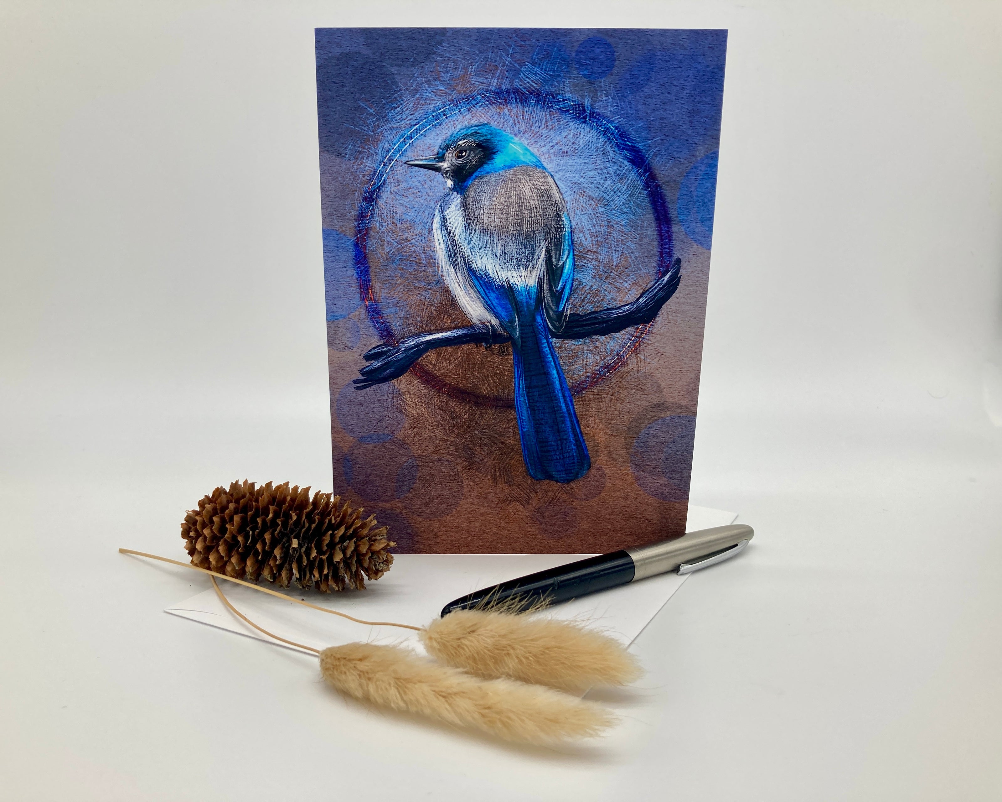 Card with a blue bird illustration on a white background with decorative items.