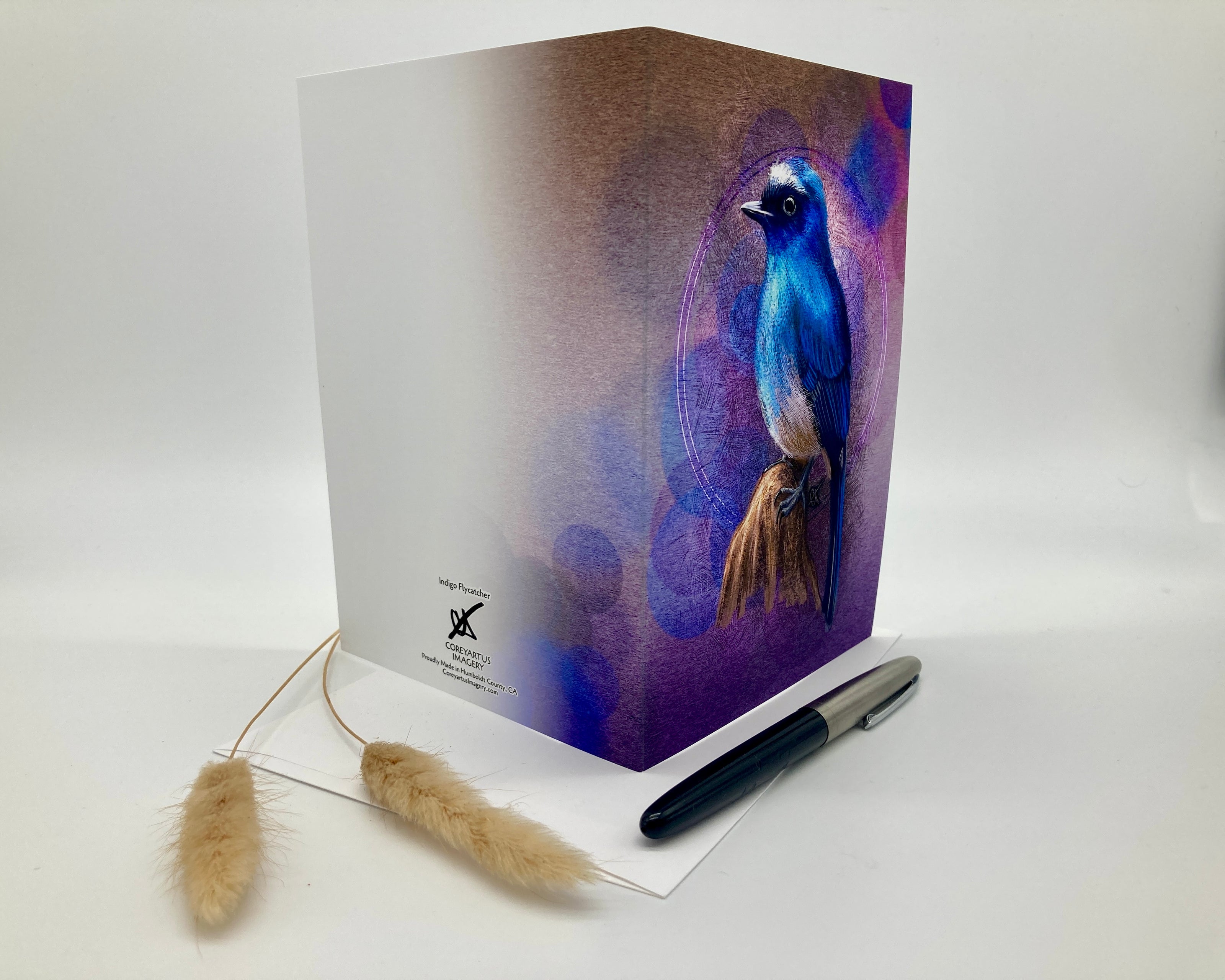 Greeting card with a blue bird design on a white background