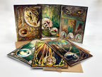 Set of artistic greeting cards with detailed illustrations on a white background